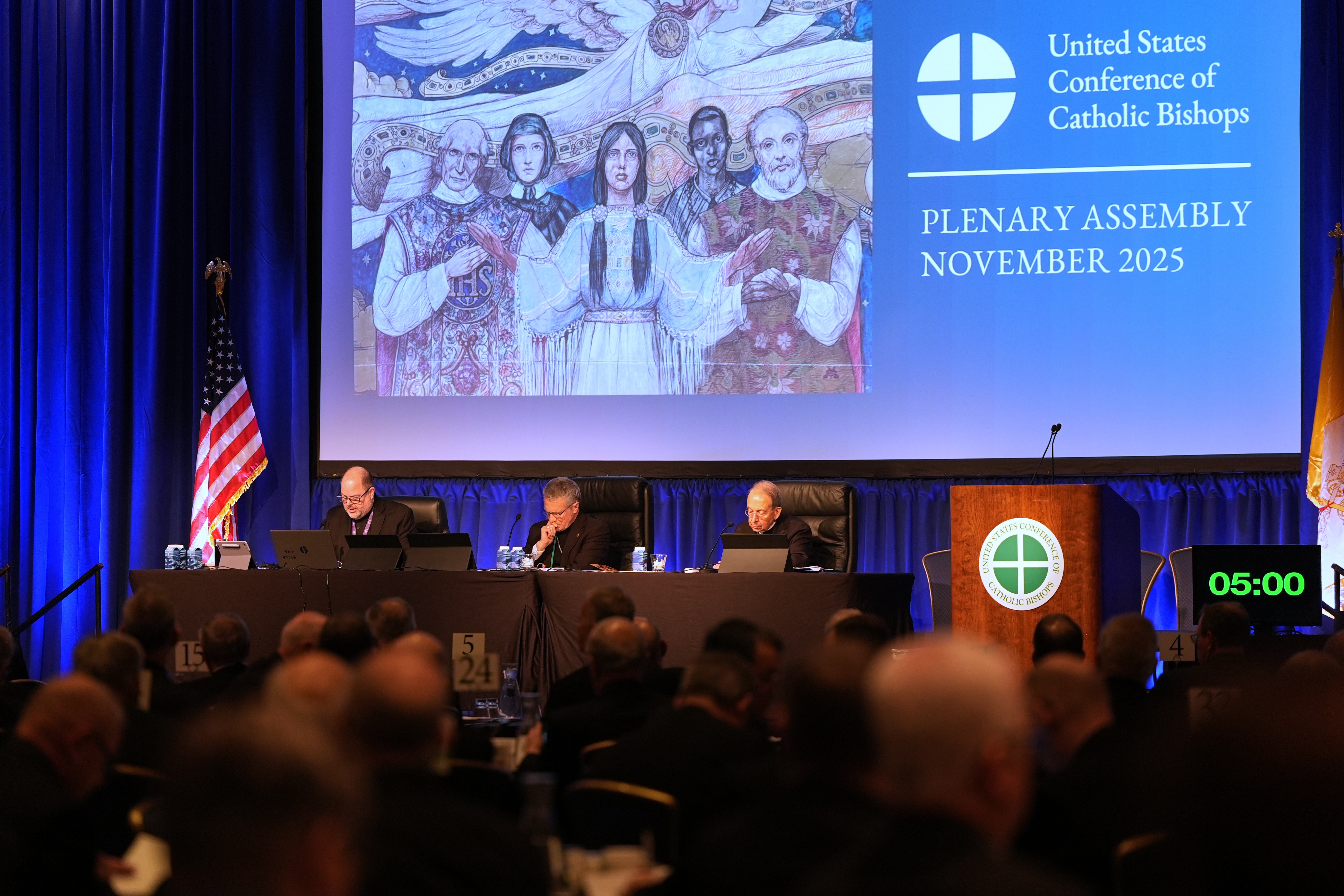 The Rev. Michael J.K. Fuller (from left), Archbishop Timothy Broglio and Archbishop William Lori of Baltimore conduct the United States Conference of Catholic Bishops plenary assembly in Baltimore on Tuesday.